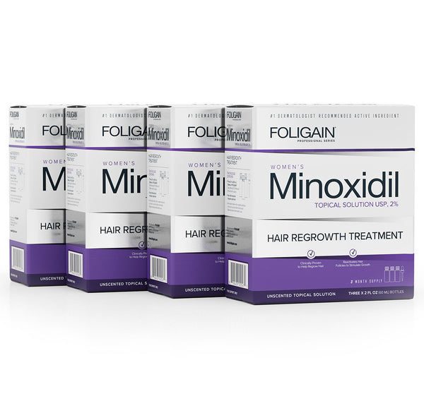 Multiple boxes of Foligain Women's Minoxidil Hair Regrowth Treatment on a white background