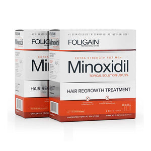Two boxes of Foligain Minoxidil hair regrowth treatment on a white background